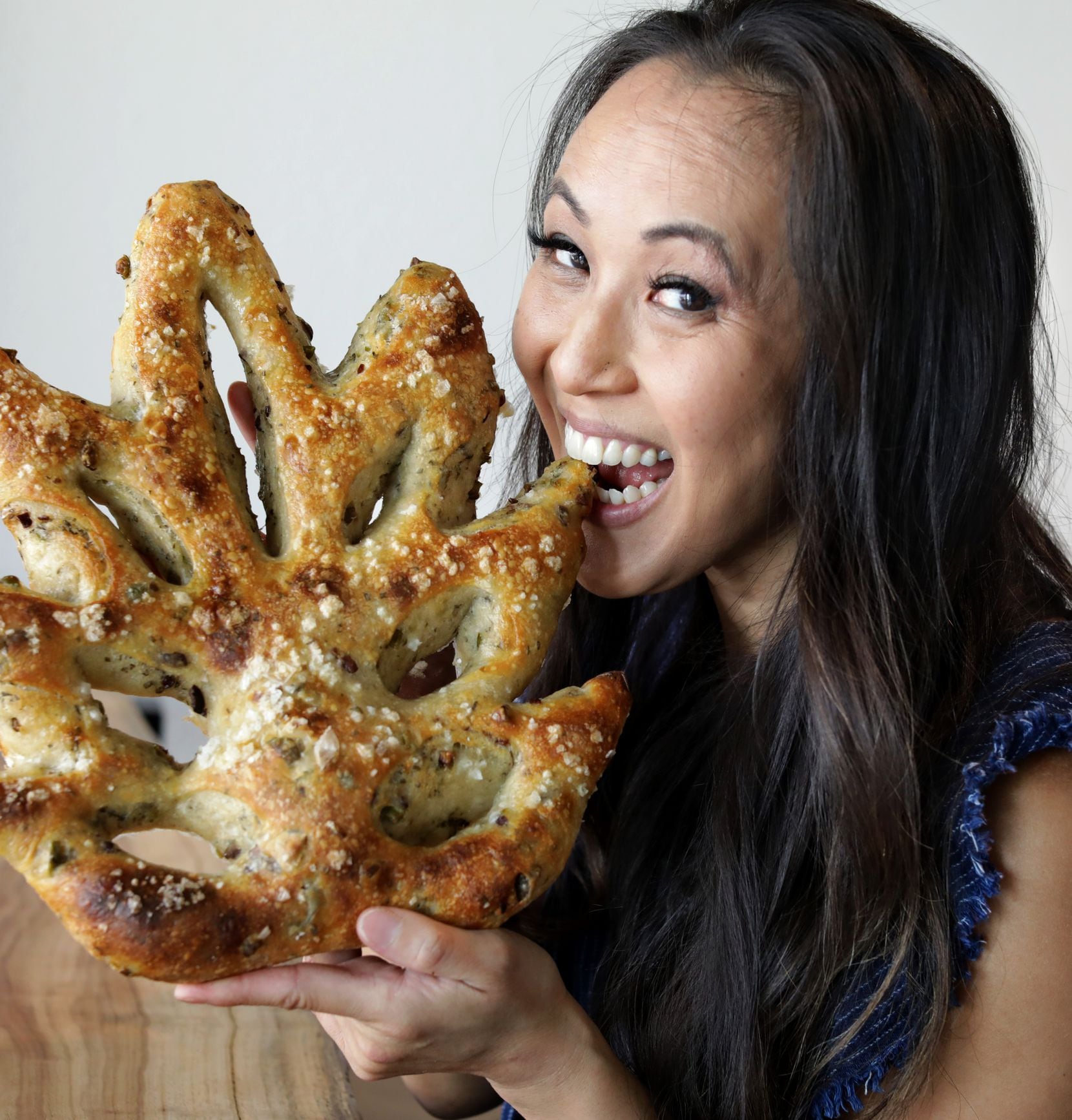 Erika Lam Radtke, owner of Girl With Flour, poses for a photograph at Mudleaf Coffee in Plano.
