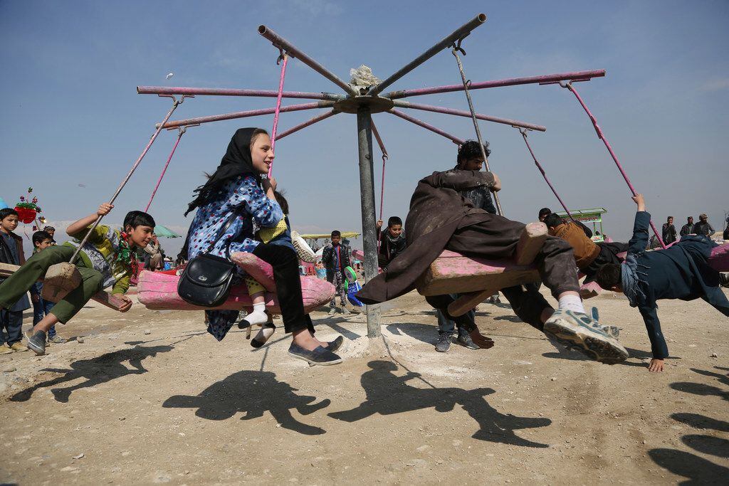 Children swing during celebrations of Nowruz, the Persian New Year, in Kabul, Afghanistan, Wednesday, March 21, 2018. Nowruz is celebrated on the first day of spring in countries including Afghanistan, Tajikistan, and Iran. (AP Photos/Rahmat Gul)