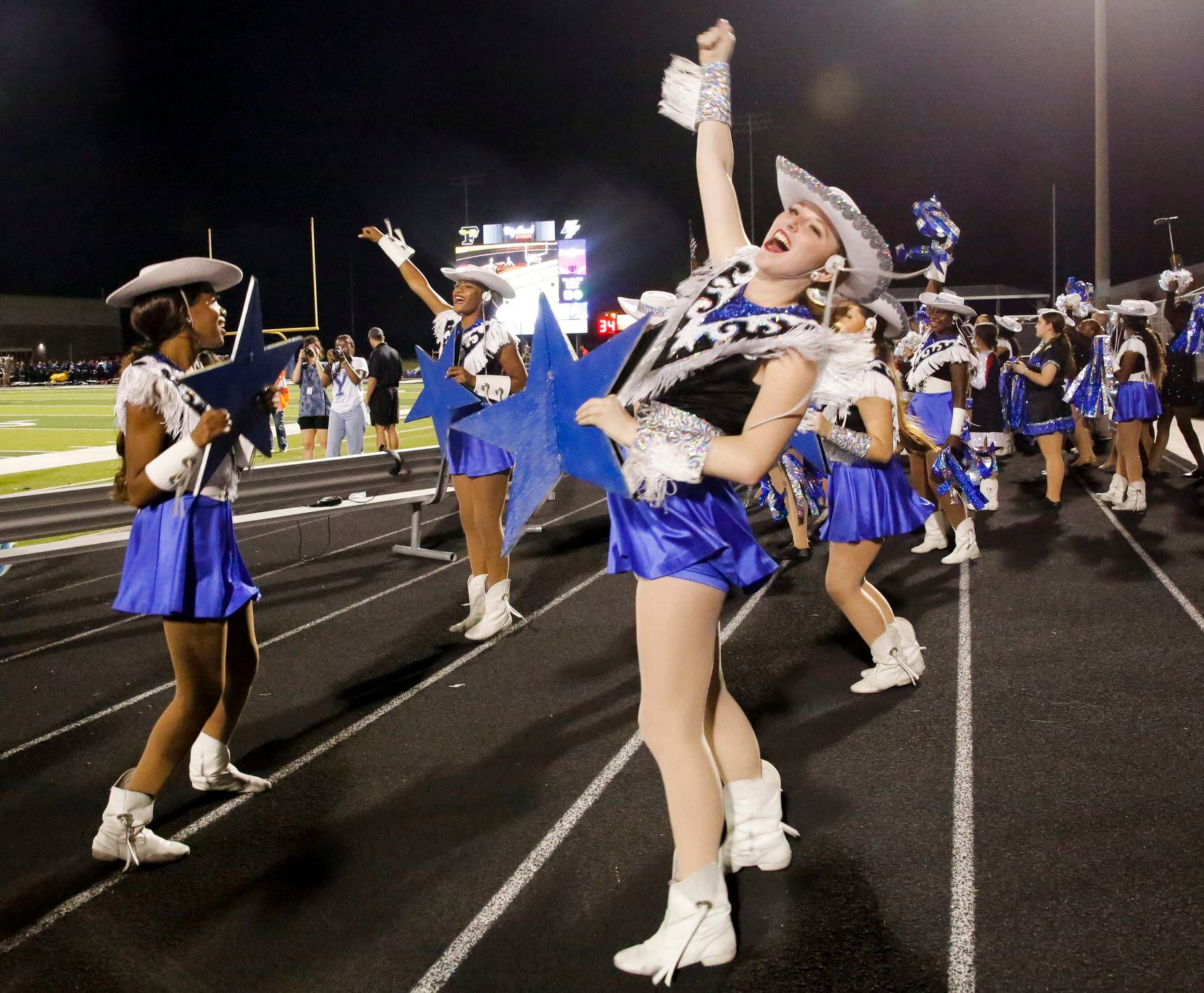 North Forney’s Sapphire Strutter Bethany Wilson cheers as her team makes a touchdown in the...
