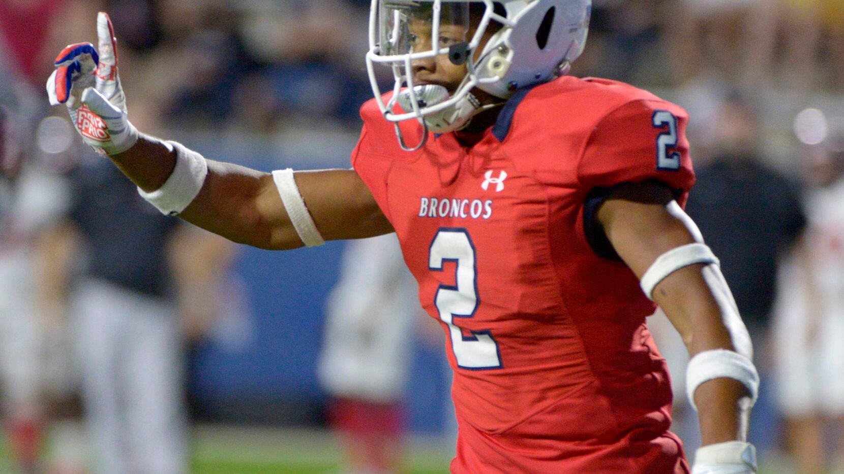 McKinney Boyd’s Ty Bolden celebrate after a fourth down stop in the first quarter of a high...
