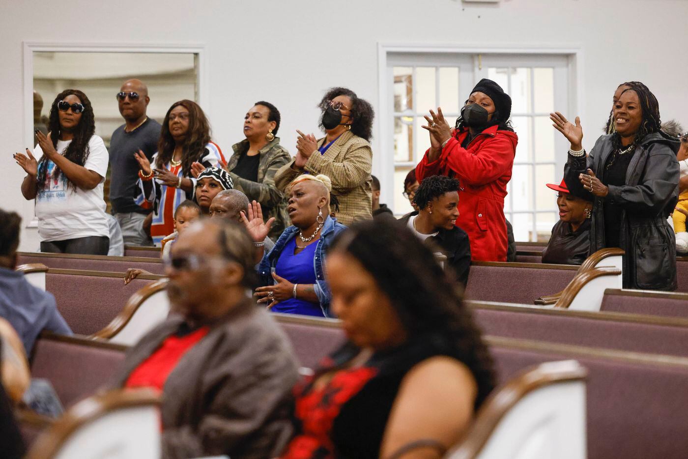 Attendees take part in a funeral service of late Legend Chappell on Saturday, March 18,...
