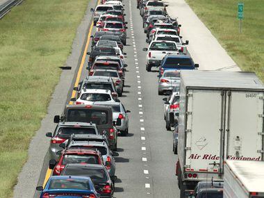 Traffic crawls on the northbound lanes of Florida's Turnpike near the intersection of...