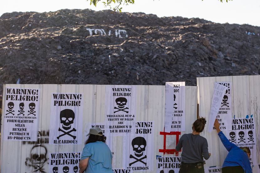 Local environmental activists posts signs declaring Shingle Mountain," the former Blue Star...