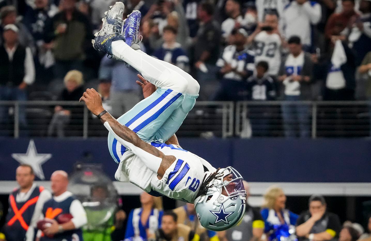 Dallas Cowboys wide receiver KaVontae Turpin does a back flip in celebration as time expires...