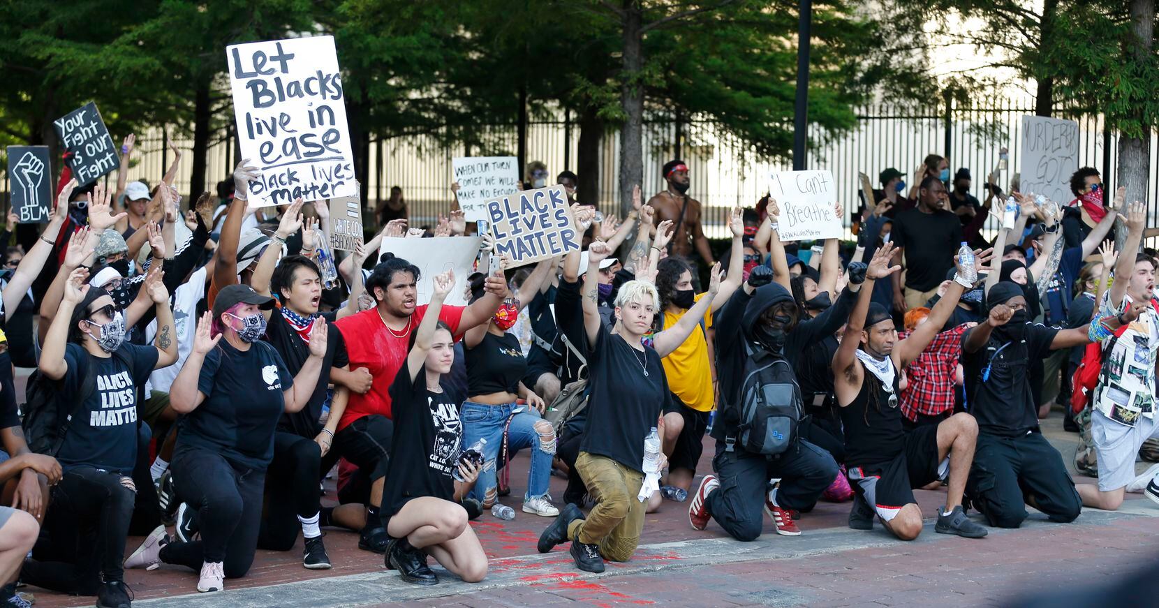 Protesters rally during a demonstration against police brutality in downtown Dallas, on Saturday, May 30, 2020. George Floyd died in police custody in Minneapolis on May 25.  (Vernon Bryant/The Dallas Morning News)