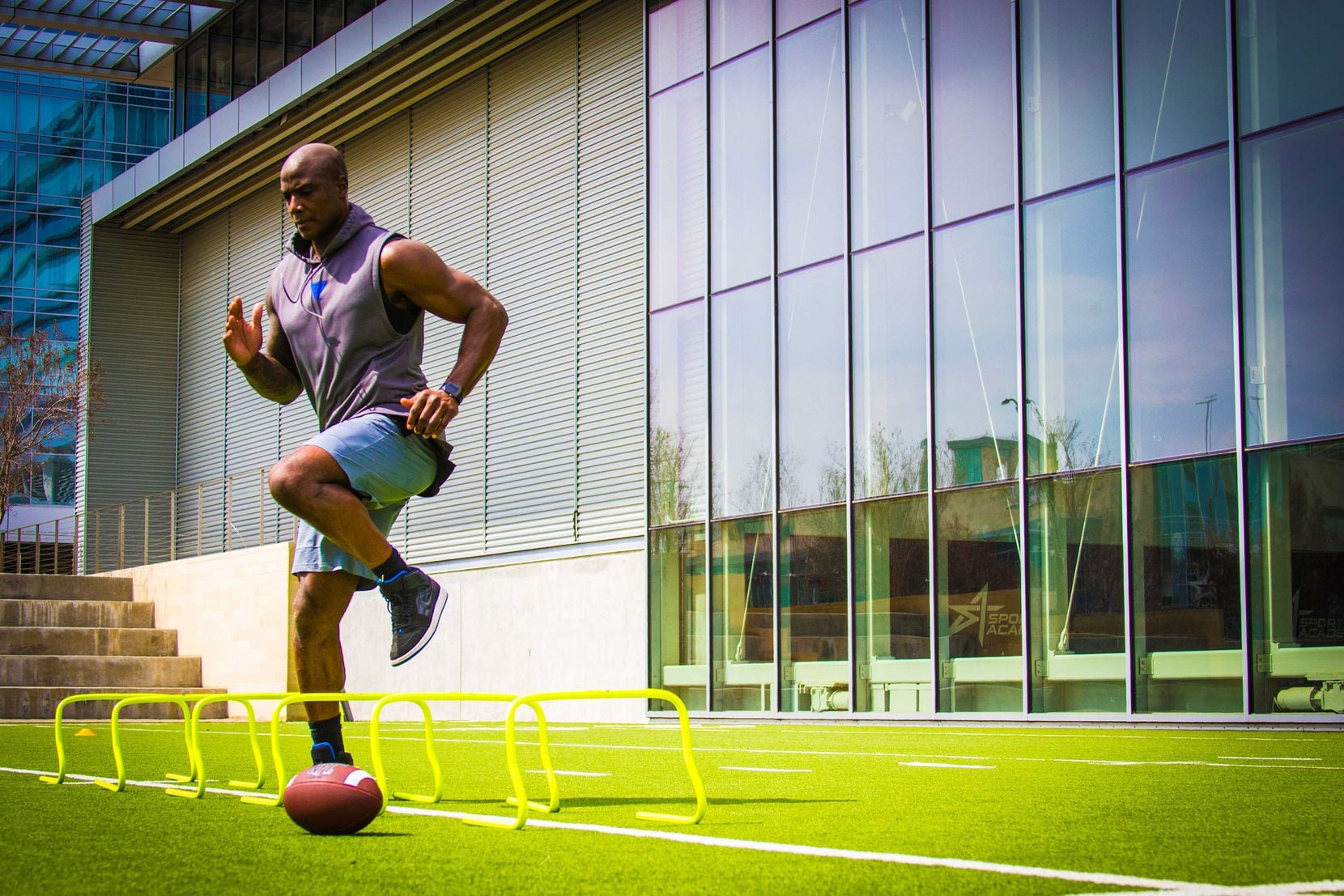 Dallas teenager Isaac Edwards captured this image of former Dallas Cowboys linebacker DeMarcus Ware training at the Star in Frisco.  Isaac received a surprise visit from Ware after winning a photo contest and attending a photo training camp.