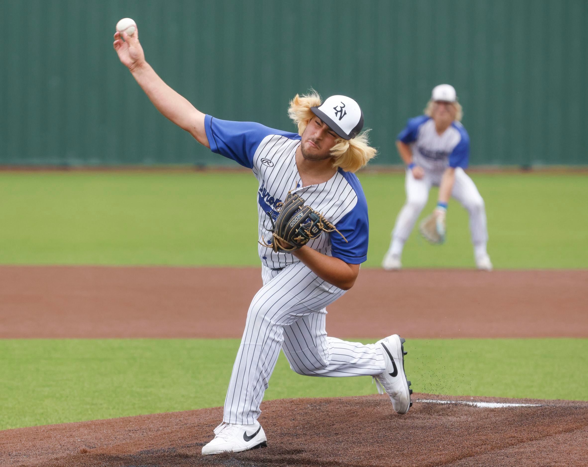 Byron Nelson High School’s Aeden Barron throws a pitch during the fifth inning of a baseball...
