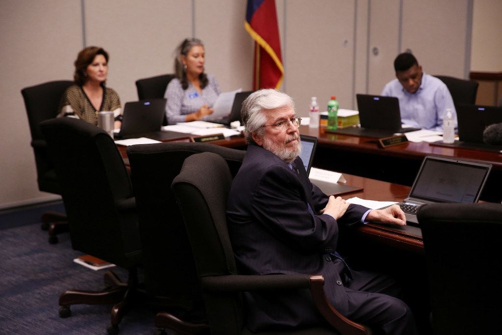 At-large trustee Larry Duncan looked at former Dallas County Schools driver Albert Walker as...