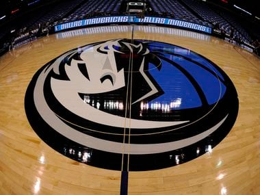 Feb 13, 2013; Dallas, TX, USA; A general view of the Dallas Mavericks logo at center court before the game between the Mavericks and the Sacramento Kings at the American Airlines Center.