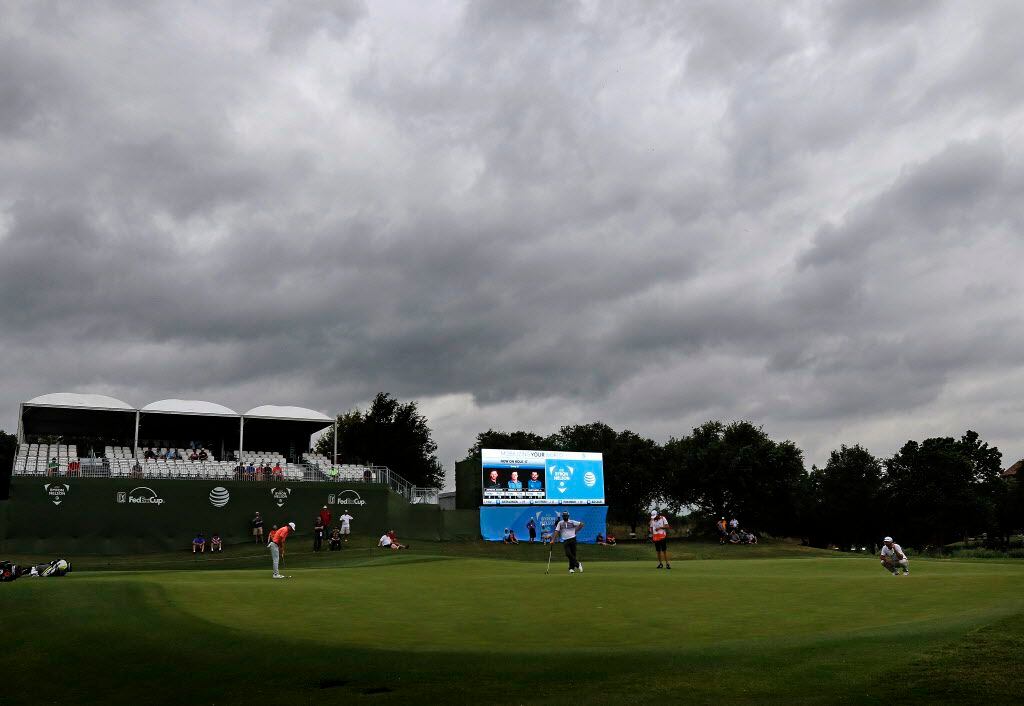 Dark clouds moved in over the 17th green during the second round of the AT&T Byron Nelson golf tournament at the TPC Four Seasons Resort in Irving on Friday.
