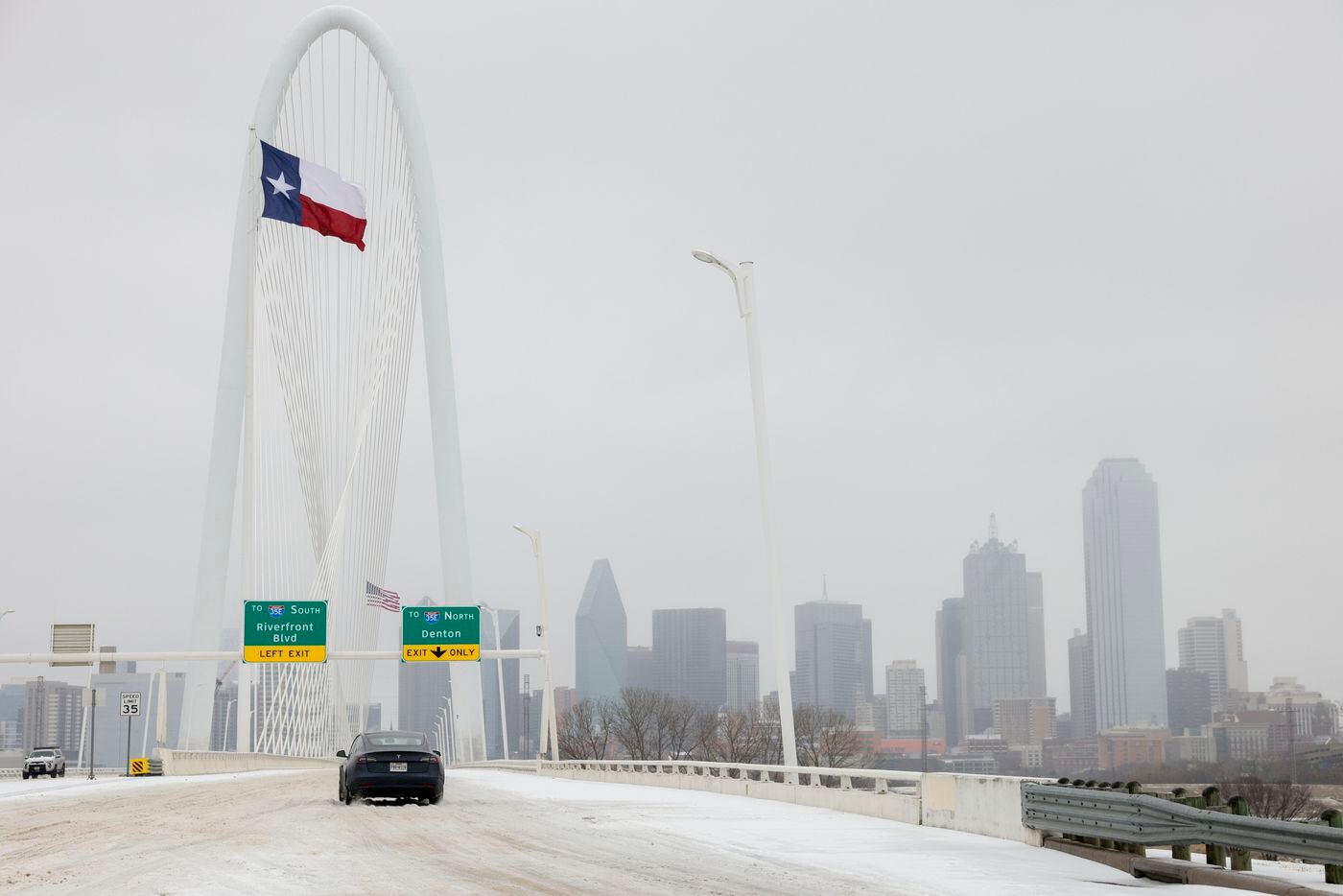 The Margaret Hunt Hill Bridge is seen covered in ice near downtown Dallas, Tuesday, Jan. 31,...