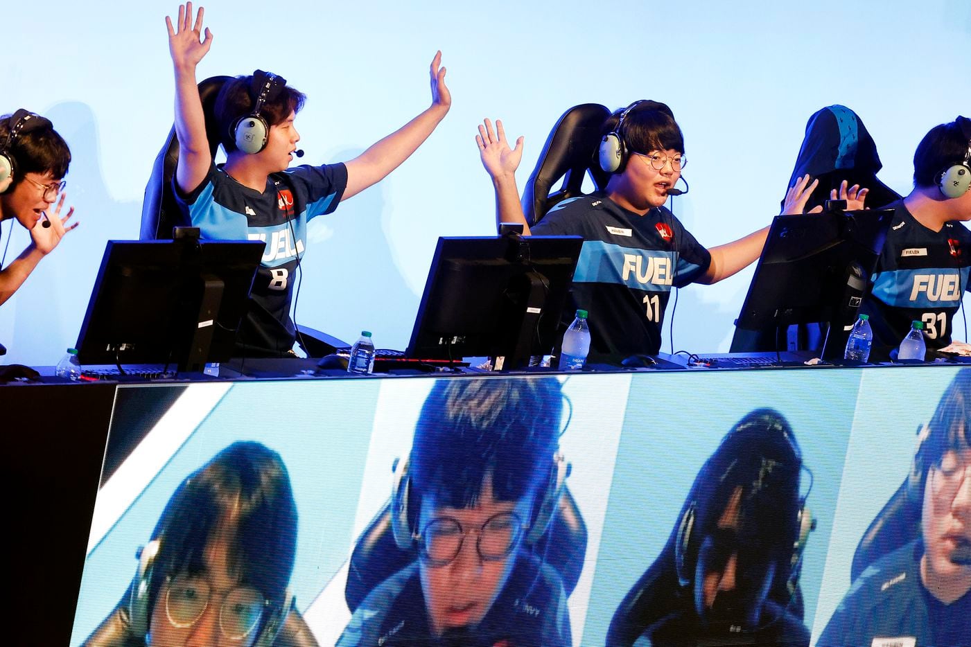 Dallas Fuel team members (from left) Kim 'Sp9rk1e' Yeonghan, Lee “Fearless” Eui-Seok, Choi ‘Hanbin’ Hanbeen and Kwon ‘Fielder’ Jun celebrate their Overwatch League win over the Houston Outlaws at Esports Stadium Arlington Friday, July 9, 2021. Dallas Fuel defeated Houston in The Battle for Texas, 3-0. It was the first in-person live competition for fans in over a year. Houston competed from their hometown. (Tom Fox/The Dallas Morning News)