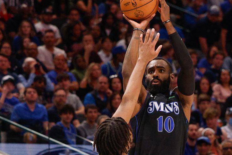 Dallas Mavericks forward Tim Hardaway Jr. (10) misses a three-point shot over Philadelphia...