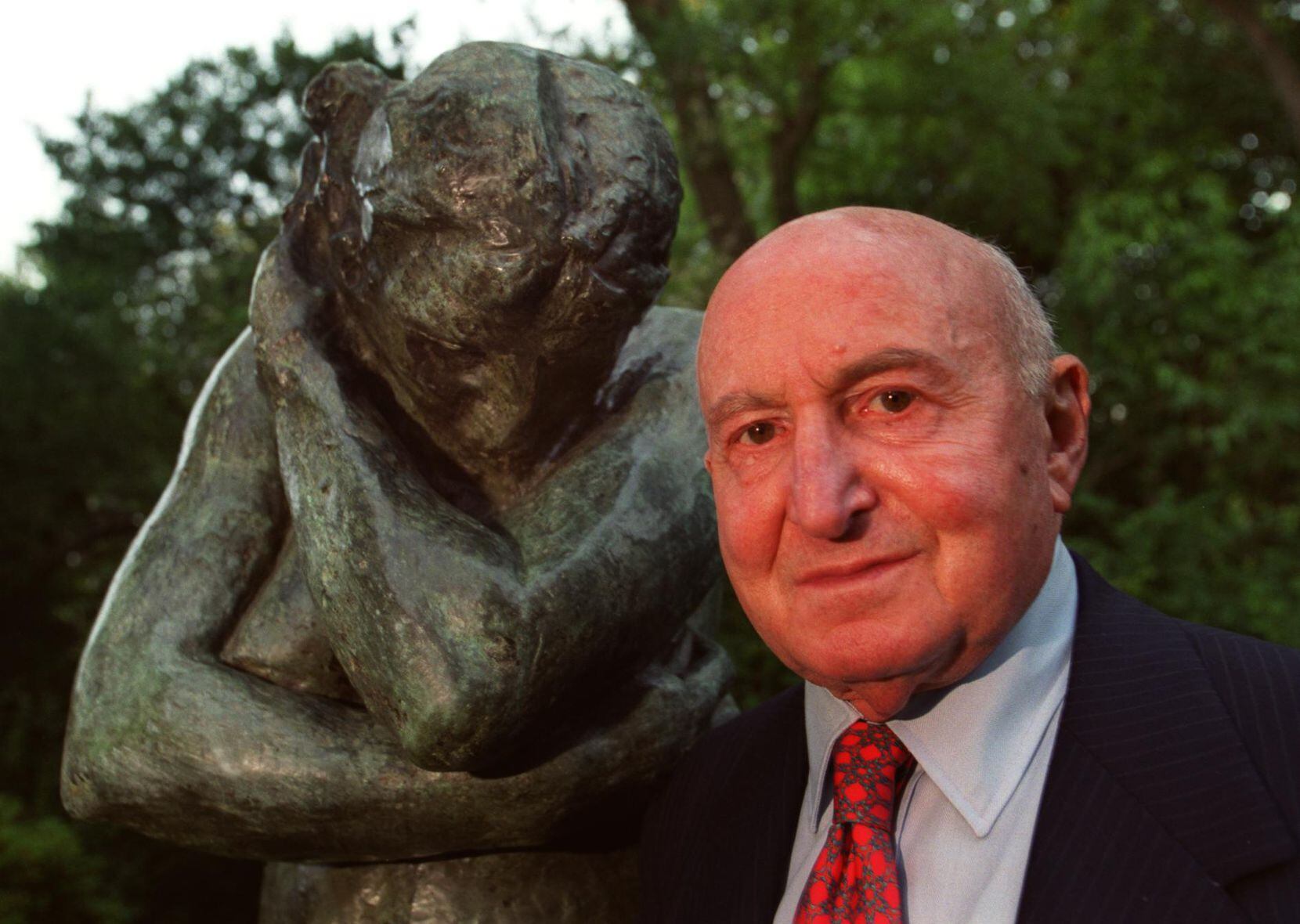 The late Dallas developer and art collector Raymond Nasher with a sculpture by August Rodin...