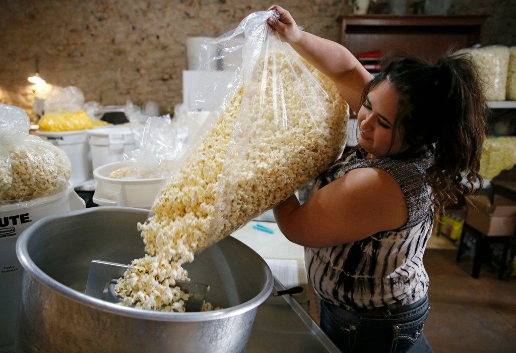 Chrissy Ray of Stephenville, Texas works on making dill pickle flavored popcorn at Hico...