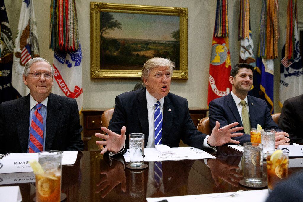 FILE - In this March 1, 2017 file photo, President Donald Trump, flanked by Senate Majority...