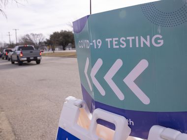 Drivers queuing for COVID-19 tests meandered around the parking lot at Ellis Davis Field House in Dallas on Thursday, January 6, 2022.
