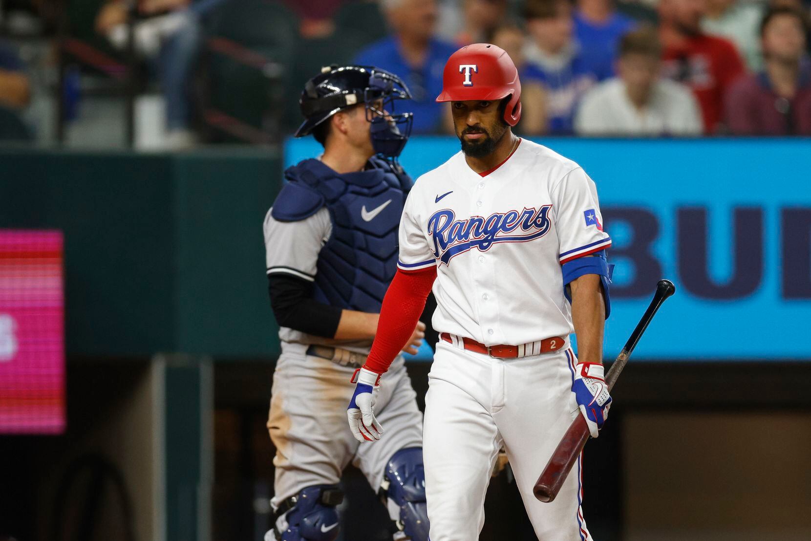 Texas Rangers second baseman Marcus Semien (2) reacts after striking out during the sixth...