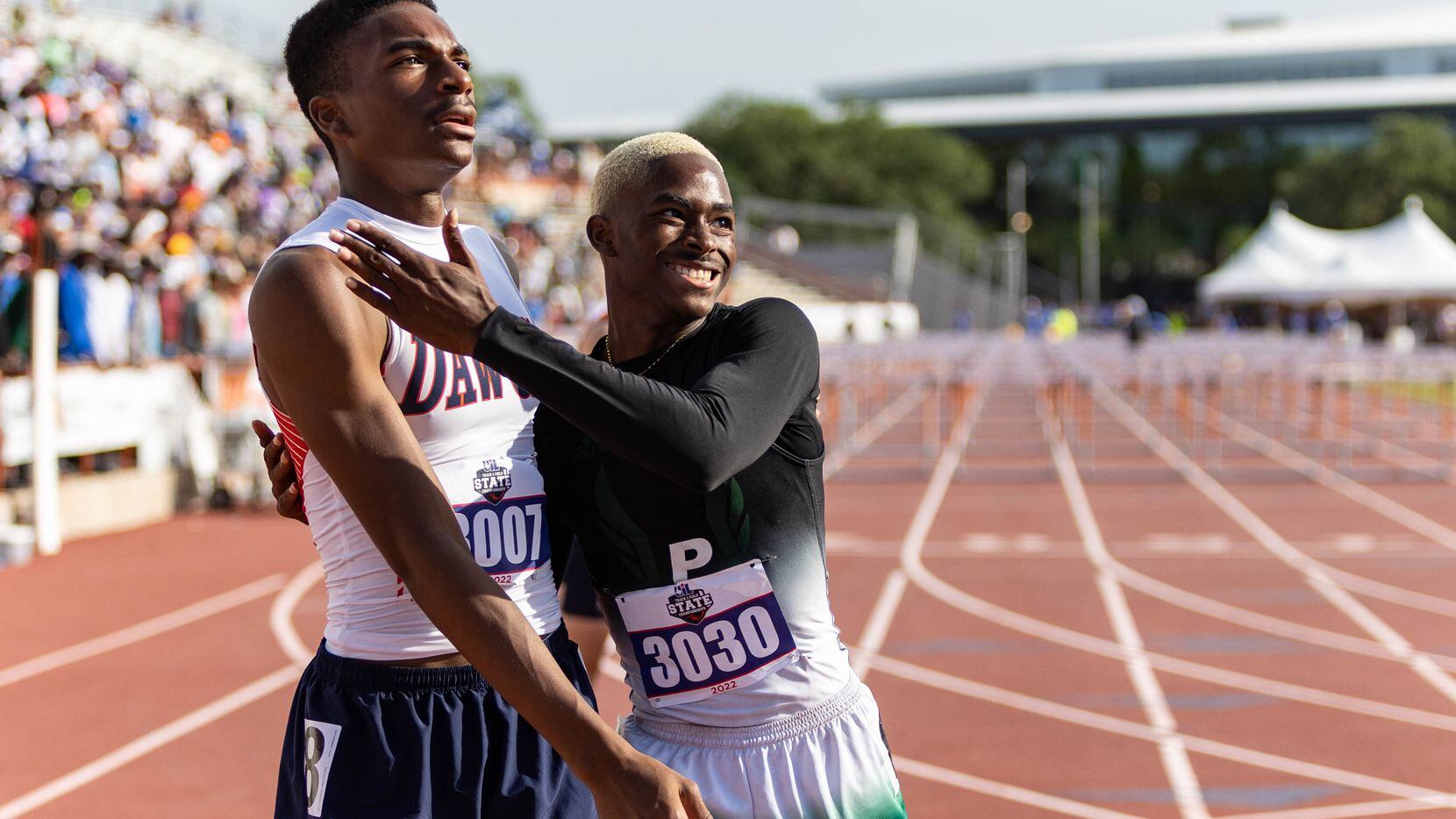 Kody Blackwood of McKinney North and Kendrick Smallwood of Mesquite Poteet embrace after the...