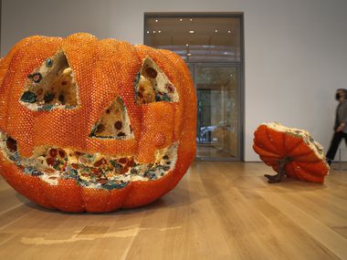 Artist Kathleen Ryan’s, 'Jackie,' 2021, is on display at the Nasher Sculpture Center. It is an oversized pumpkin that is encrusted with semiprecious stones that convincingly simulate spreading mold.