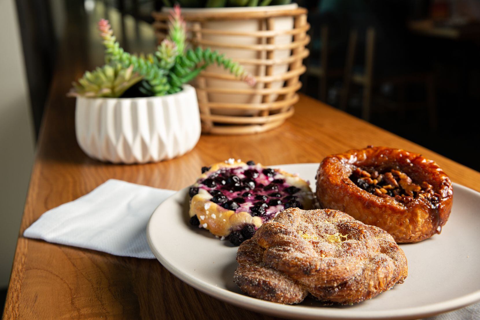 A variety of pastries baked by the Village baking team are sold at Doughregarde’s Bake Shop.