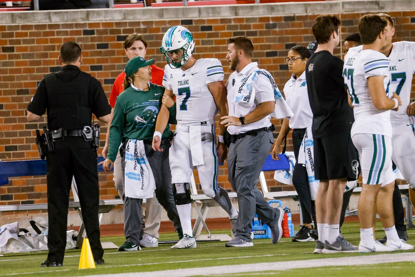 Tulane Green Wave quarterback Michael Pratt (7) is helped off the field during the fourth...