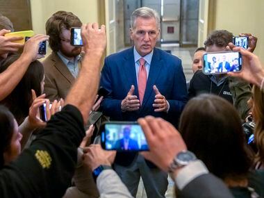 Reporters at the Capitol surround Speaker of the House Kevin McCarthy, R-Calif., as they...