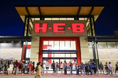 Customers wait in line ahead of the opening of H-E-B on Wednesday, July 19, 2023 in McKinney. 