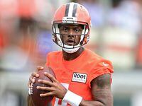 Cleveland Browns quarterback Deshaun Watson throws a pass during training camp practice in...