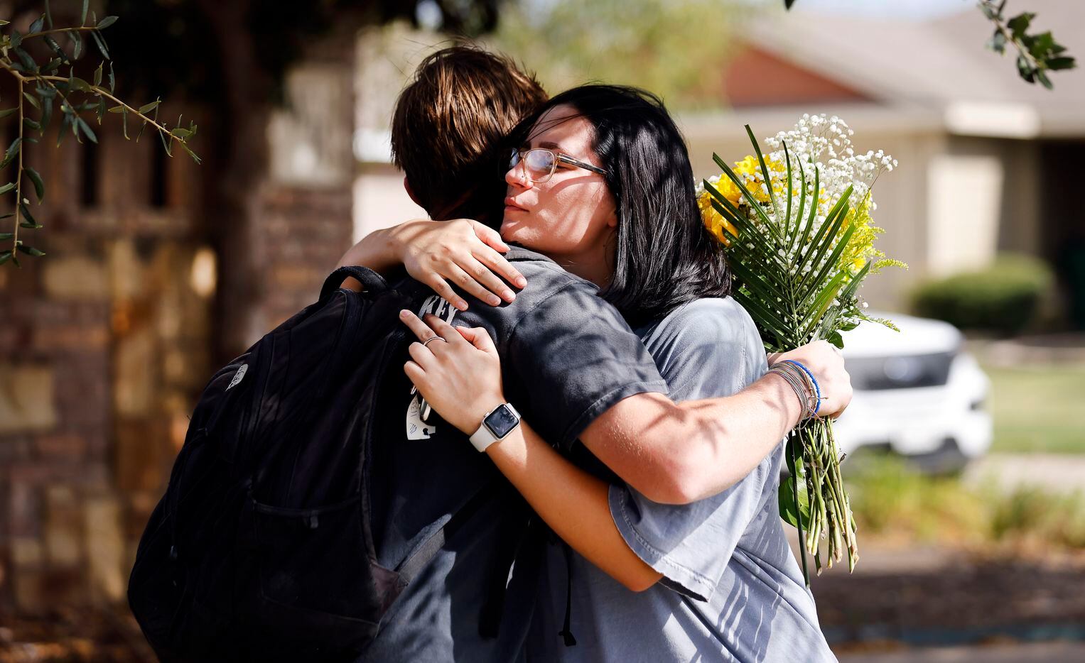 After the first day of school, Lucas Davison (left) received a hug from a stranger (who...