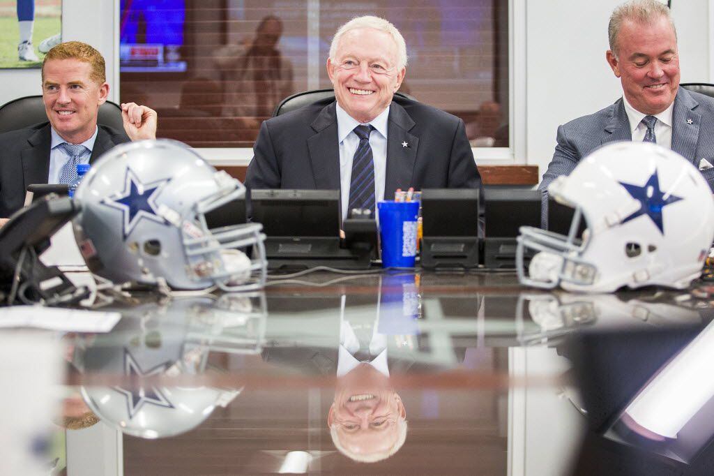 Dallas Cowboys head coach Jason Garrett, owner Jerry Jones and his son, executive vice...