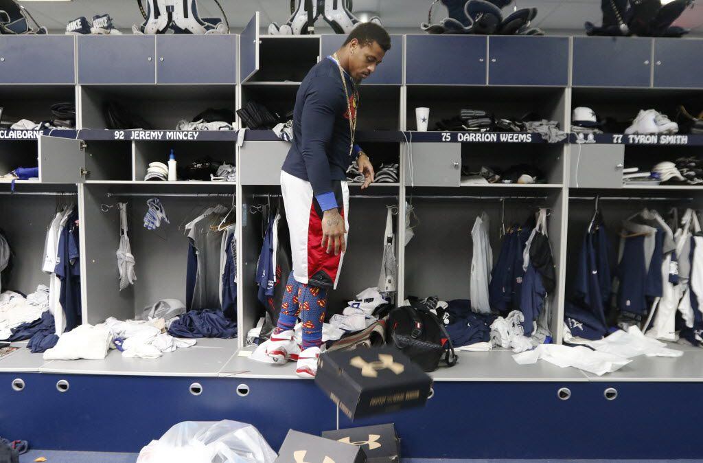Defensive end Greg Hardy, who becomes a free agent this offseason, cleans out his locker at...