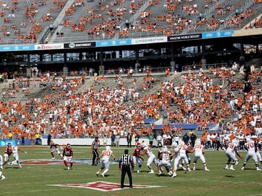 Texas Longhorns quarterback Hudson Card (1) throws a second quarter pass against the Oklahoma Sooners in a socially-distanced Red River Rivalry at the Cotton Bowl in Dallas, Saturday, October 10, 2020. Oklahoma won in quadruple overtime, 53-45.