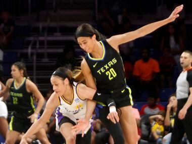 Dallas Wings forward Isabelle Harrison (20) defends against LA Sparks guard Chennedy Carter...