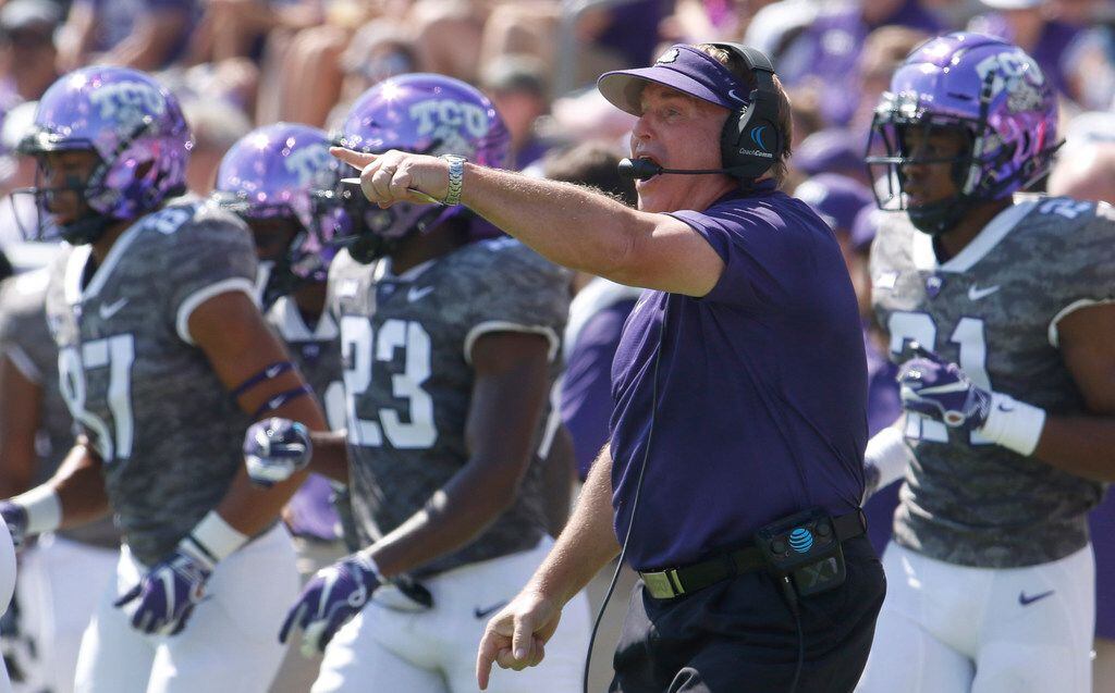 TCU head coach Gary Patterson makes a point as he directs his players during first half...