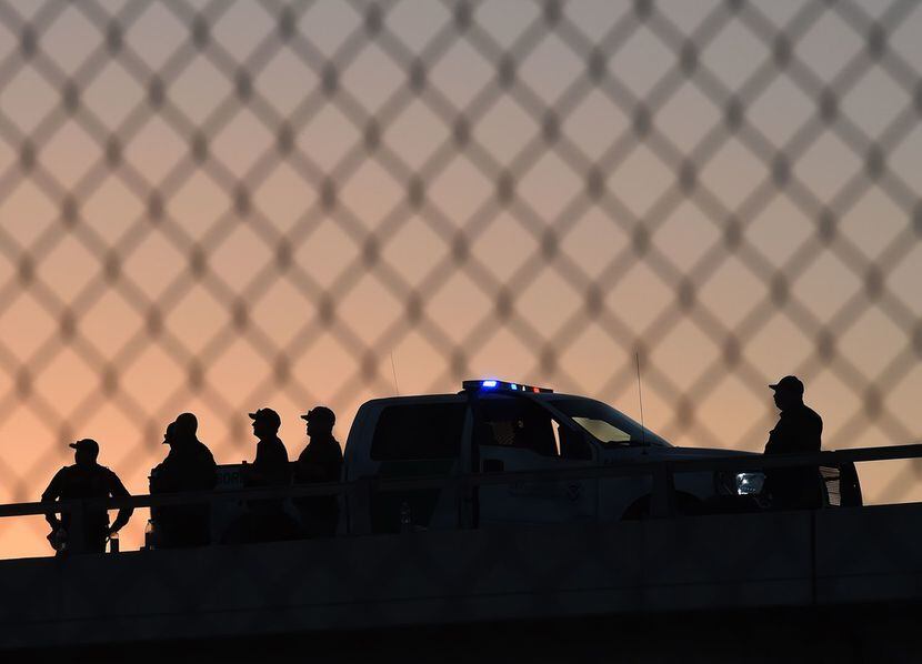 U.S. Border Patrol officers guard the fence separating US and Mexico in El Paso in 2016.