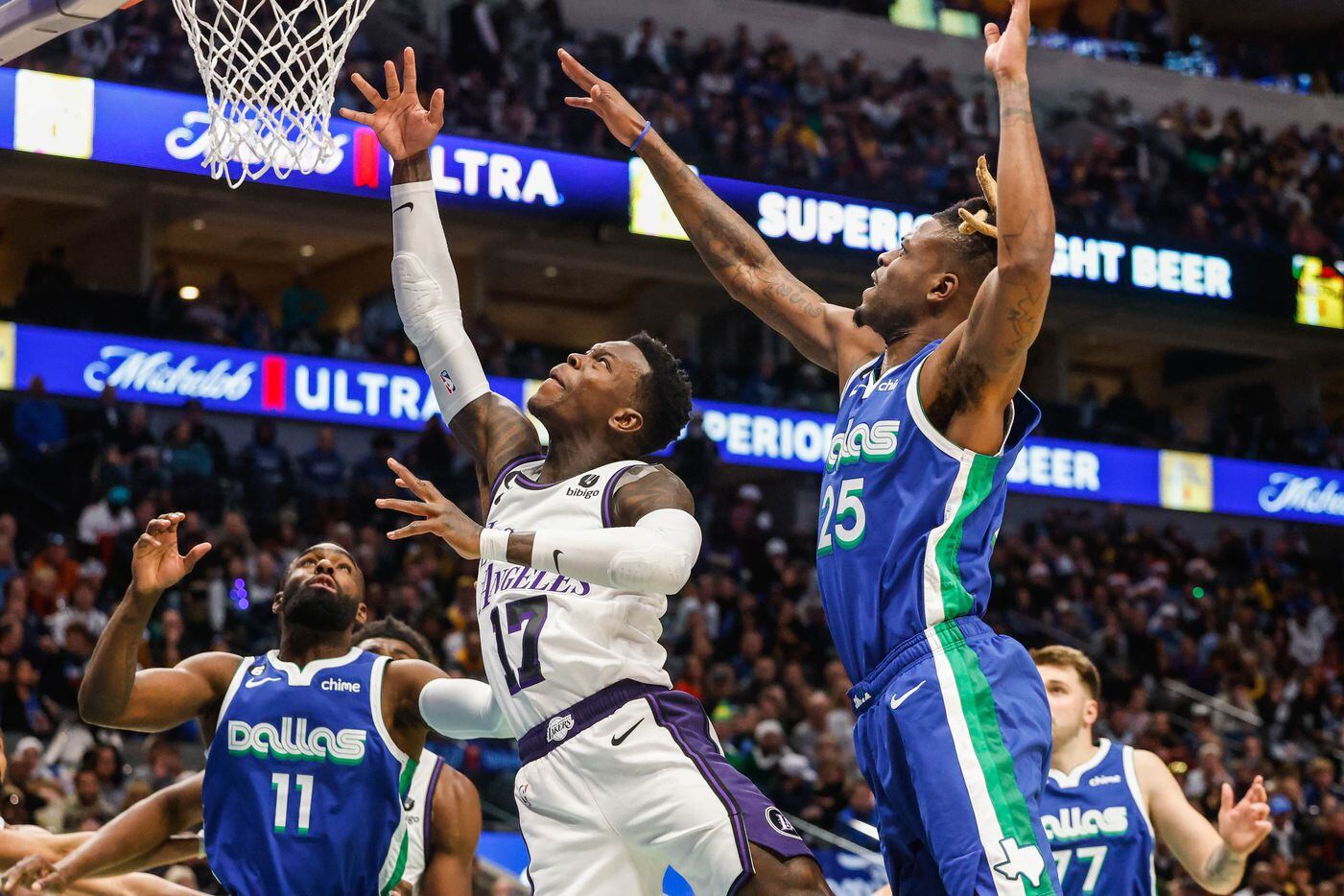 Los Angeles Lakers guard Dennis Schroder (17) goes for a shot as Dallas Mavericks forward...