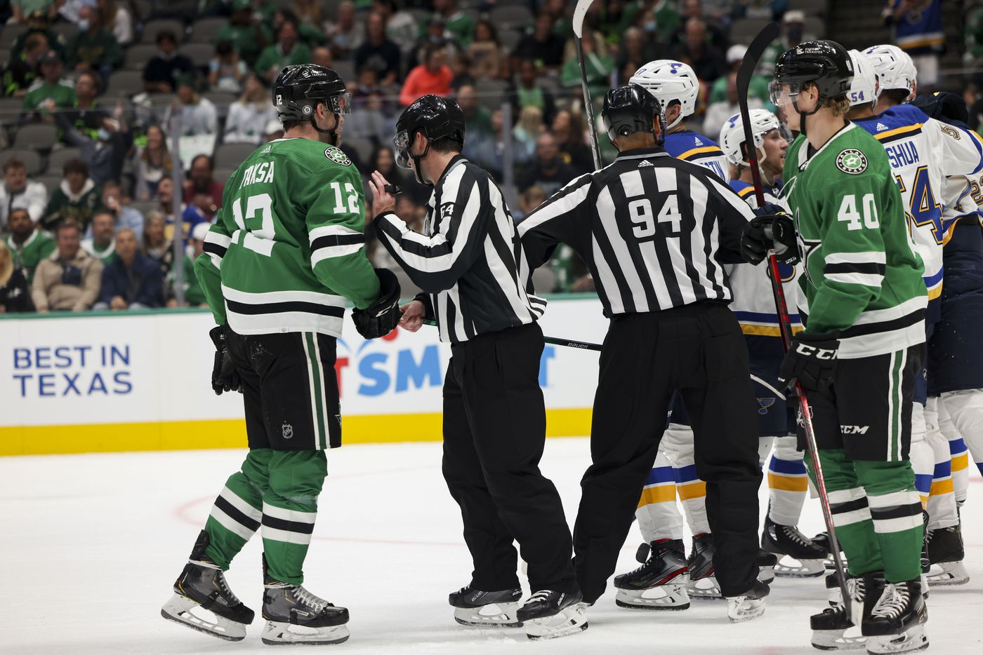 Referees separate players during the second period of a Dallas Stars preseason game against St. Louis Blues on Tuesday, Oct. 5, 2021, at American Airlines Center in Dallas. (Juan Figueroa/The Dallas Morning News)
