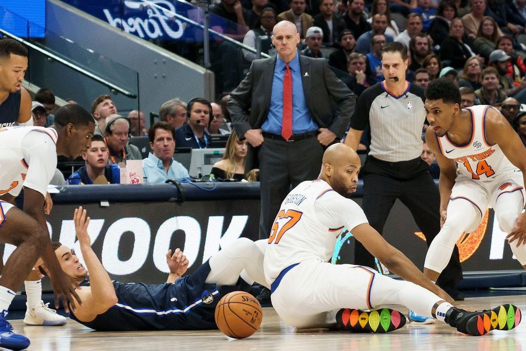 Dallas Mavericks forward Dwight Powell (7) fights for a loose ball with New York Knicks forward Taj Gibson (67) during the first half of an NBA basketball game at American Airlines Center on Friday, Nov. 8, 2019, in Dallas. (Smiley N. Pool/The Dallas Morning News)