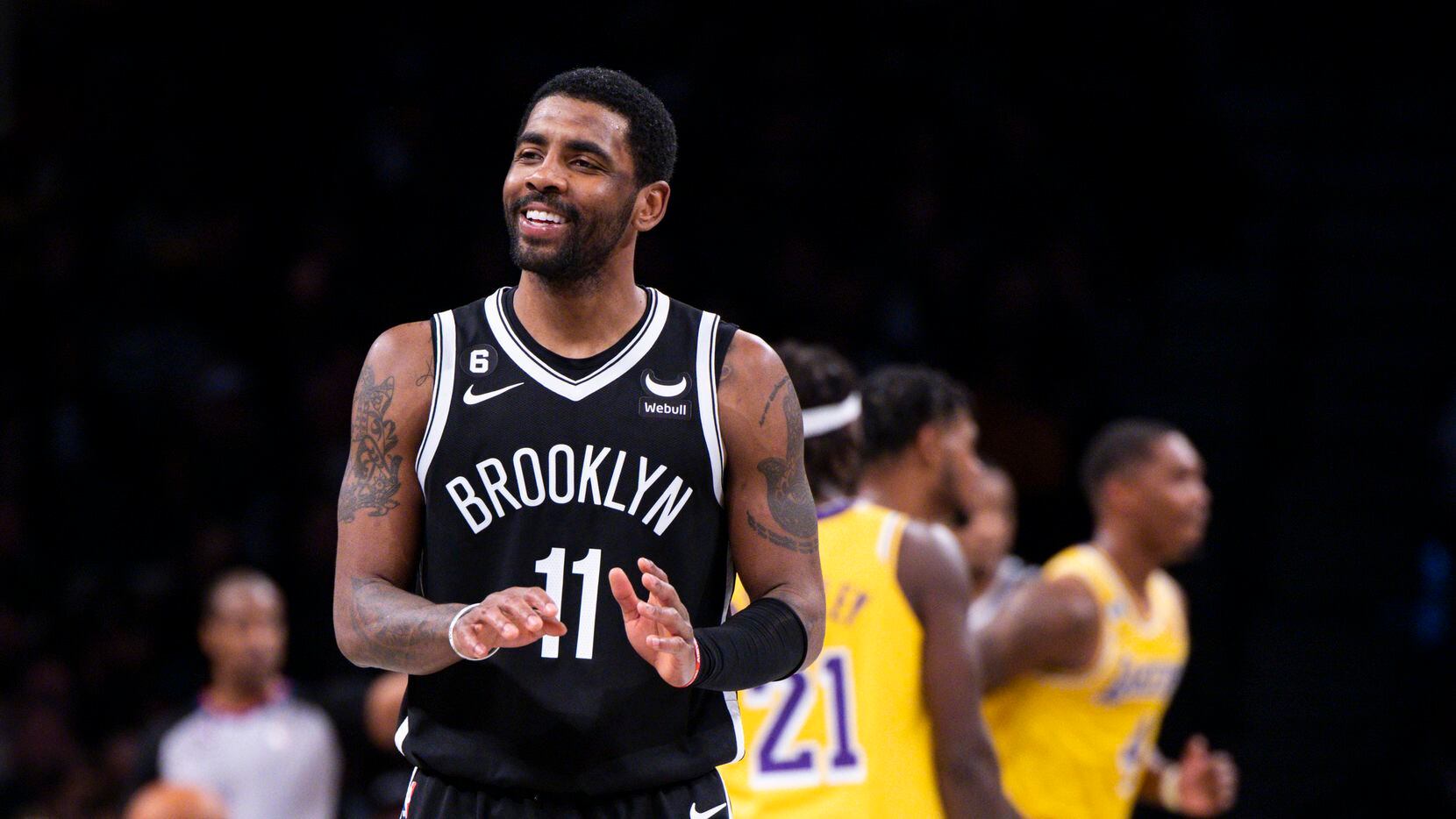 Brooklyn Nets guard Kyrie Irving (11) reacts during the second half of an NBA basketball...