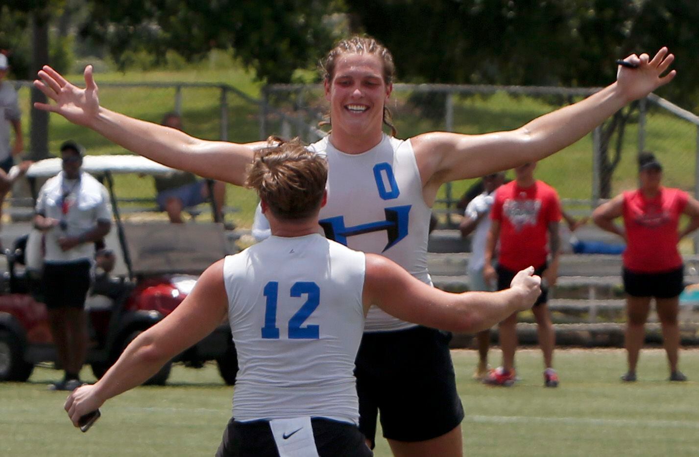 Hebron Hawks Carter Brock (0) and Chris Workley (12) celebrate after the team's 28-26 victory over Lake Travis in the championship game to claim the Division 1 title. The state 7 on 7 football tournament attracted athletes from schools throughout the state. The competition brackets for the final day of competition was held at Veterans Park in College Station on June 25, 2021. (Steve Hamm/ Special Contributor)