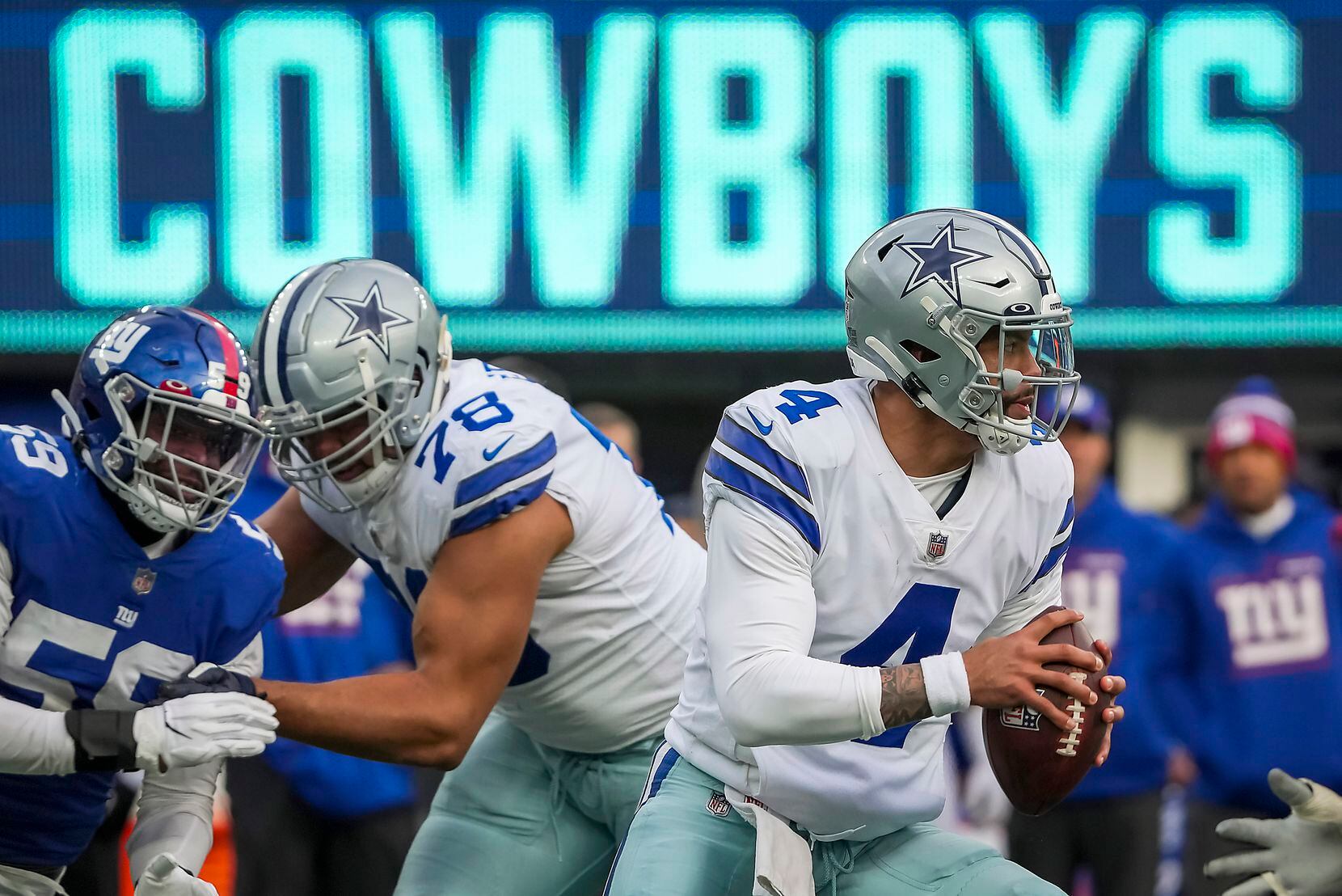 Dallas Cowboys quarterback Dak Prescott (4) looks to pass as offensive tackle Terence Steele...