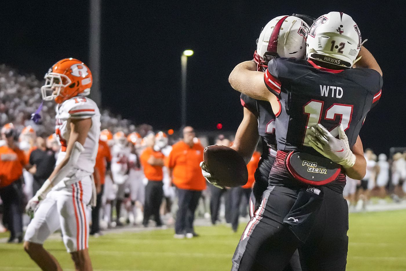 Rockwall-Heath tight end Lance Mason (38) celebrates with Caleb Hoover (12) after a...