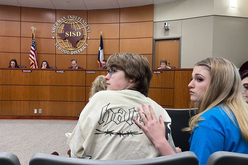 Max Hightower and his sister sit at the Sherman ISD school board meeting on Nov. 13.