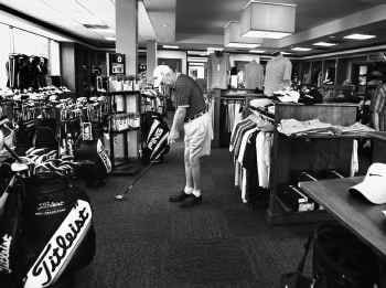  Hardy Tadlock tries out some clubs in the pro shop at Brookhaven Country Club in Farmers...