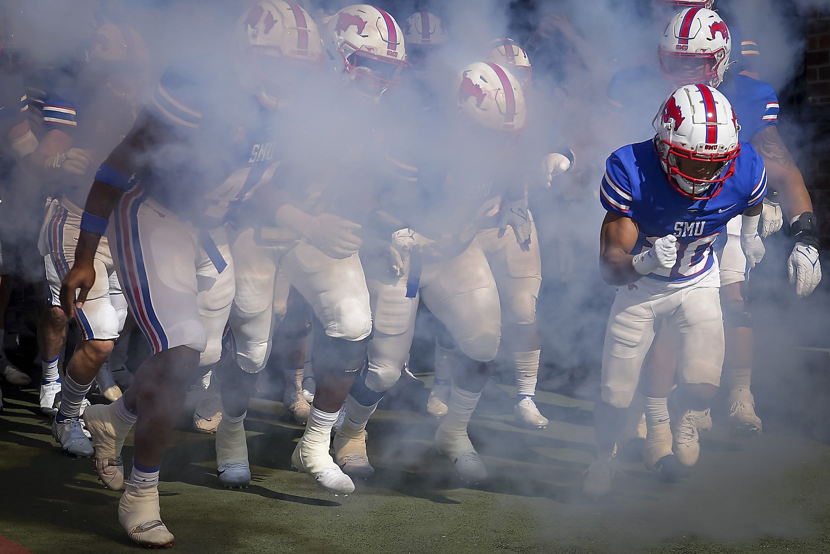 SMU players take the field to face UCF in an NCAA football game at Ford Stadium on Saturday,...