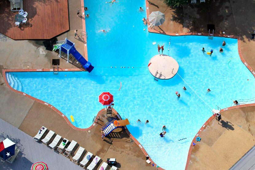 Swimmers enjoy The Texas Pool, a swimming pool shaped like the state of Texas, located in...