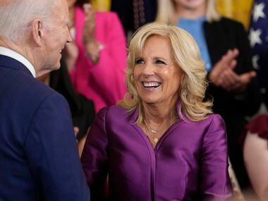 First lady Jill Biden looks at President Joe Biden after she spoke during an event in the...