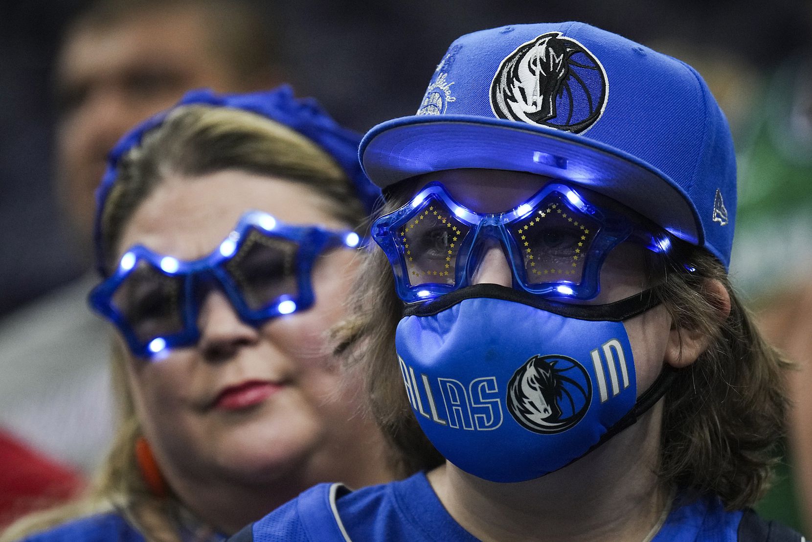 Dallas Mavericks fans watch the teams warm up before Game 7 of an NBA second round playoff...