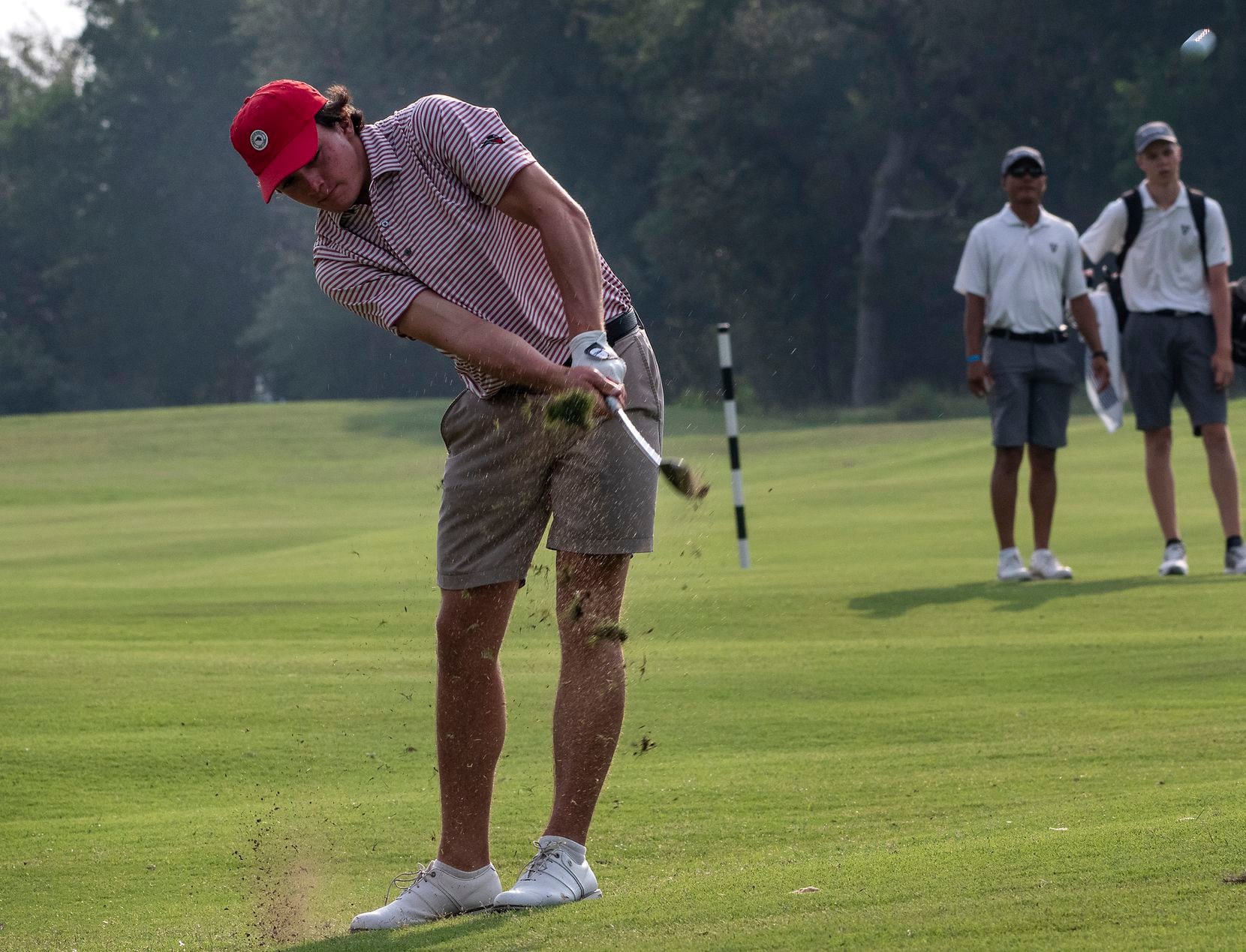 Flower Mound Marcus, Algya Trevor, hits from the no.1 fairway during the first round of the...
